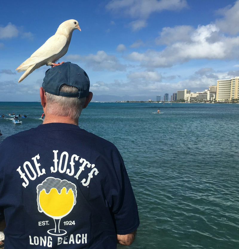 Joe Jost's shirt with a bird on the hat